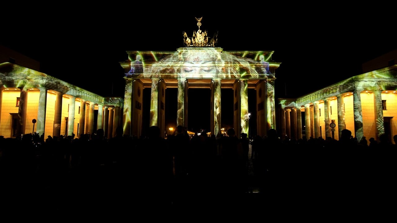 The Brandenburg Gate in Berlin covered in a golden 3D projection mapping