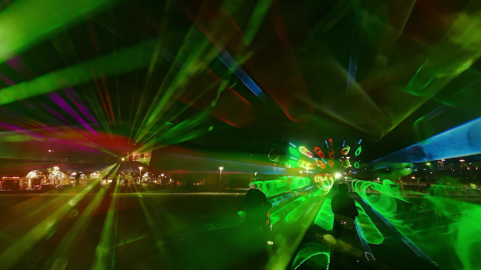 Beams of pink, green and blue light drawn through fog at the Marx-Engels-Forum, Berlin, 2023