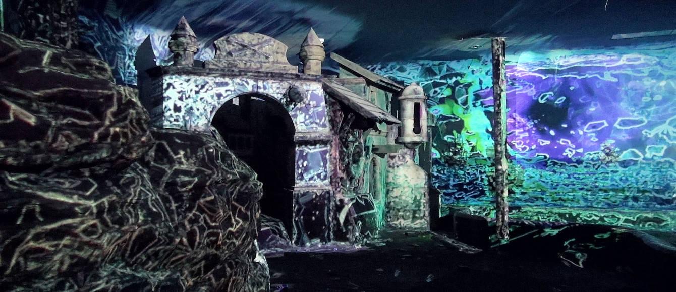 The vaulted interior of a castle hall in Austria transformed by projection mapping