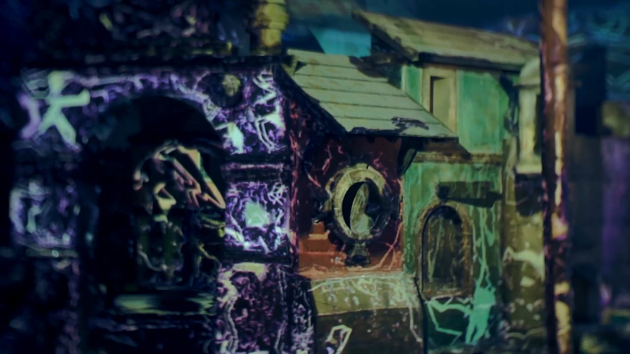 Still from the RE:SORB showreel showing the colourful projection-mapped façade of an opera house
